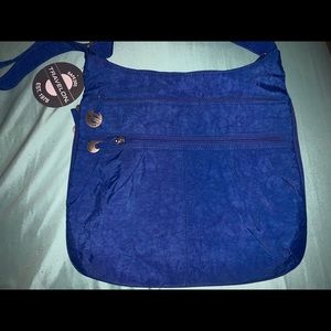 Water resistant travel on crossover bag